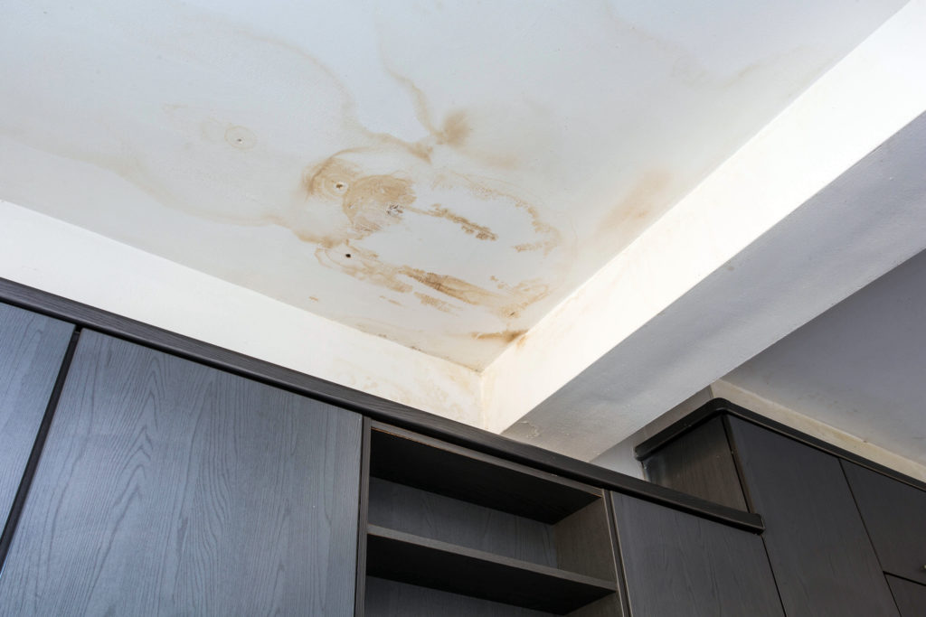 signs of a roof leak are water stains on the ceiling in the corner