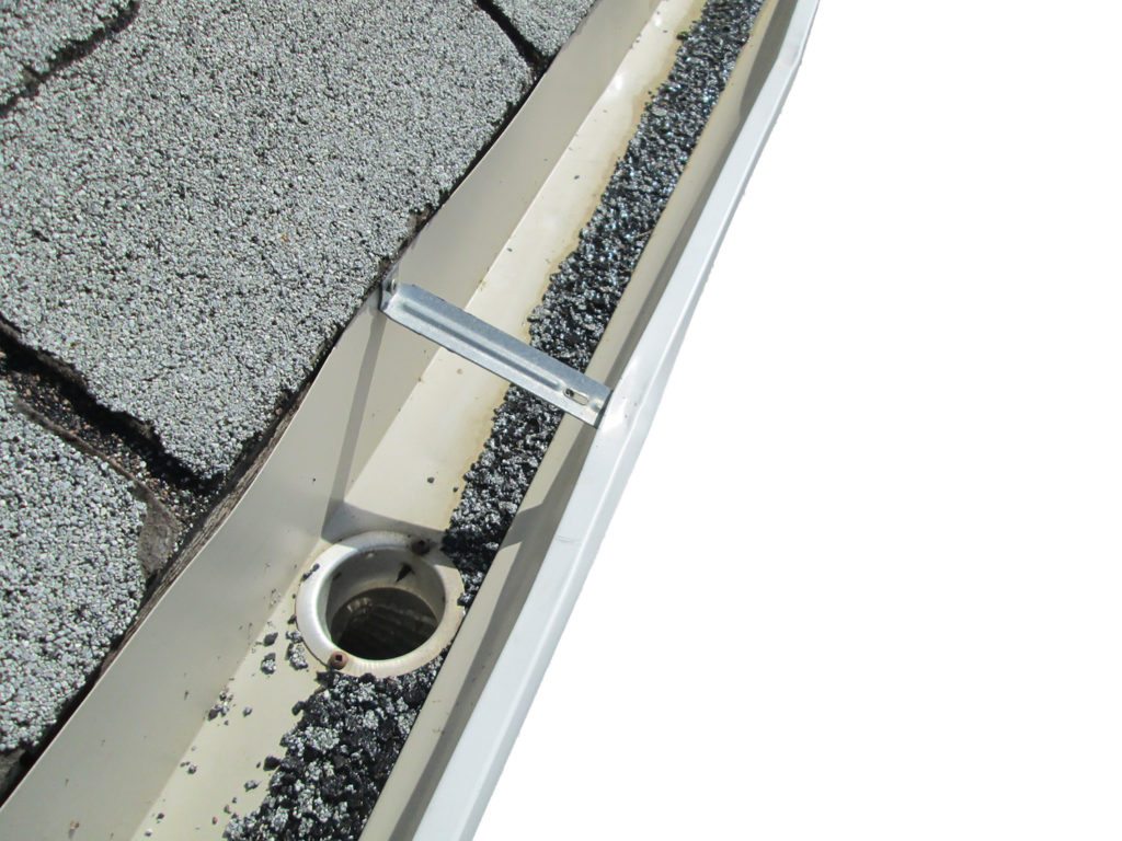 granules in your gutters is a sign of hail damage